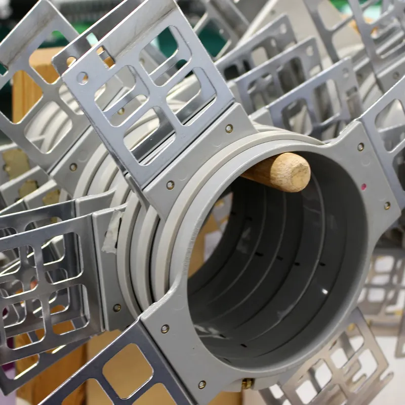 Embroidery hoops stacked on the production floor