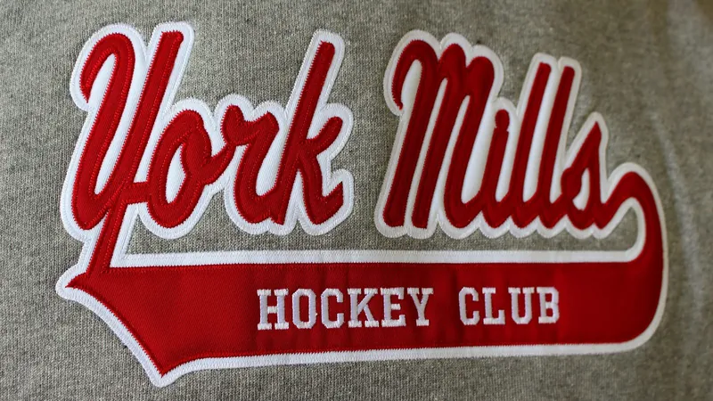 Close-up of a company logo stitched on a fleece chest