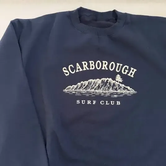 Navy sweatshirt with an embroidered surf club design