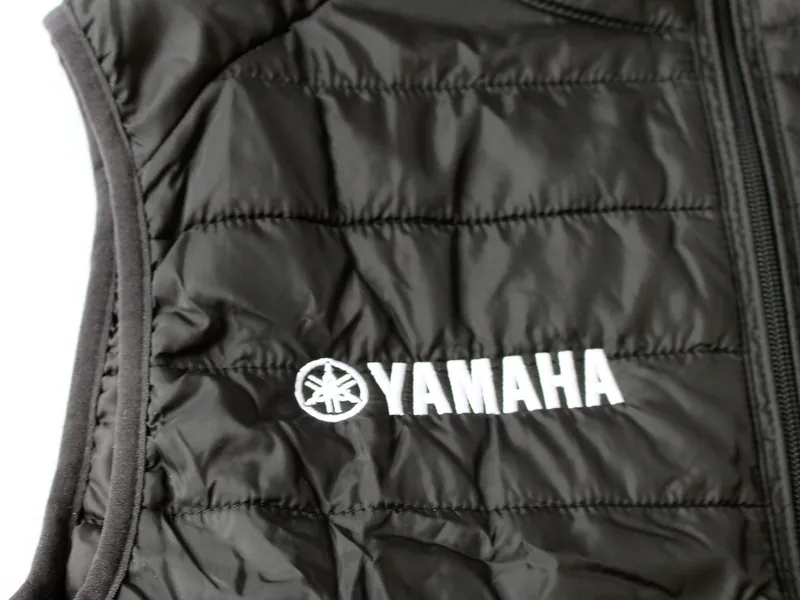 Work vest with a company logo embroidered on the chest