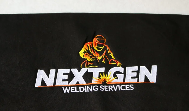 Welding company logo embroidered on a black tee